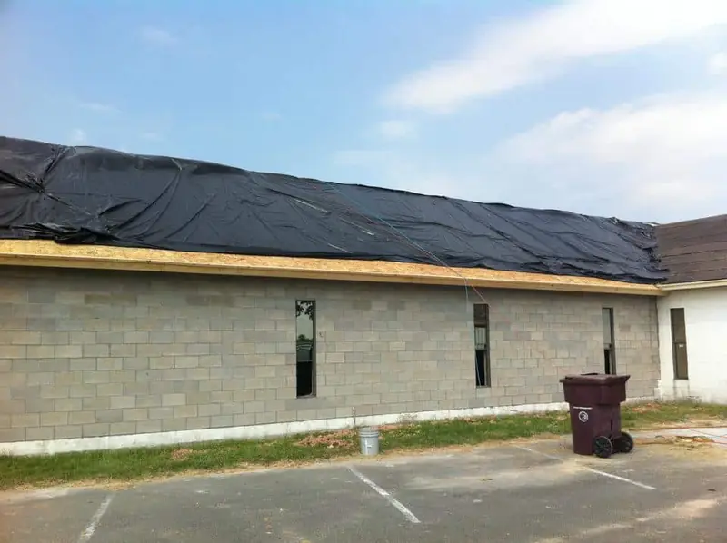 Commercial building roof with new underlayment