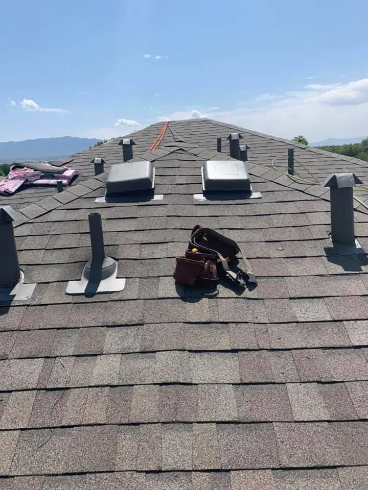 Roof vents and pipe boots set in new shingles